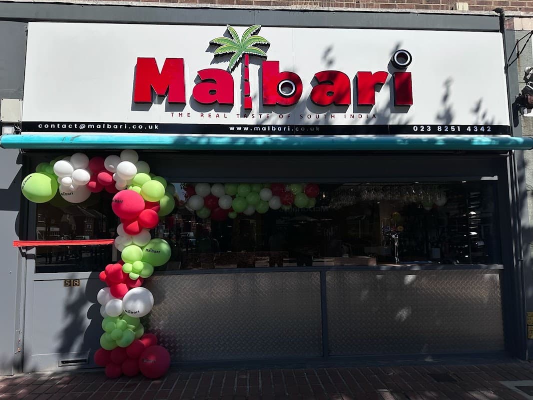 The Malbari Restaurant shopfront on West Street, Havant, decorated with an opening celebration